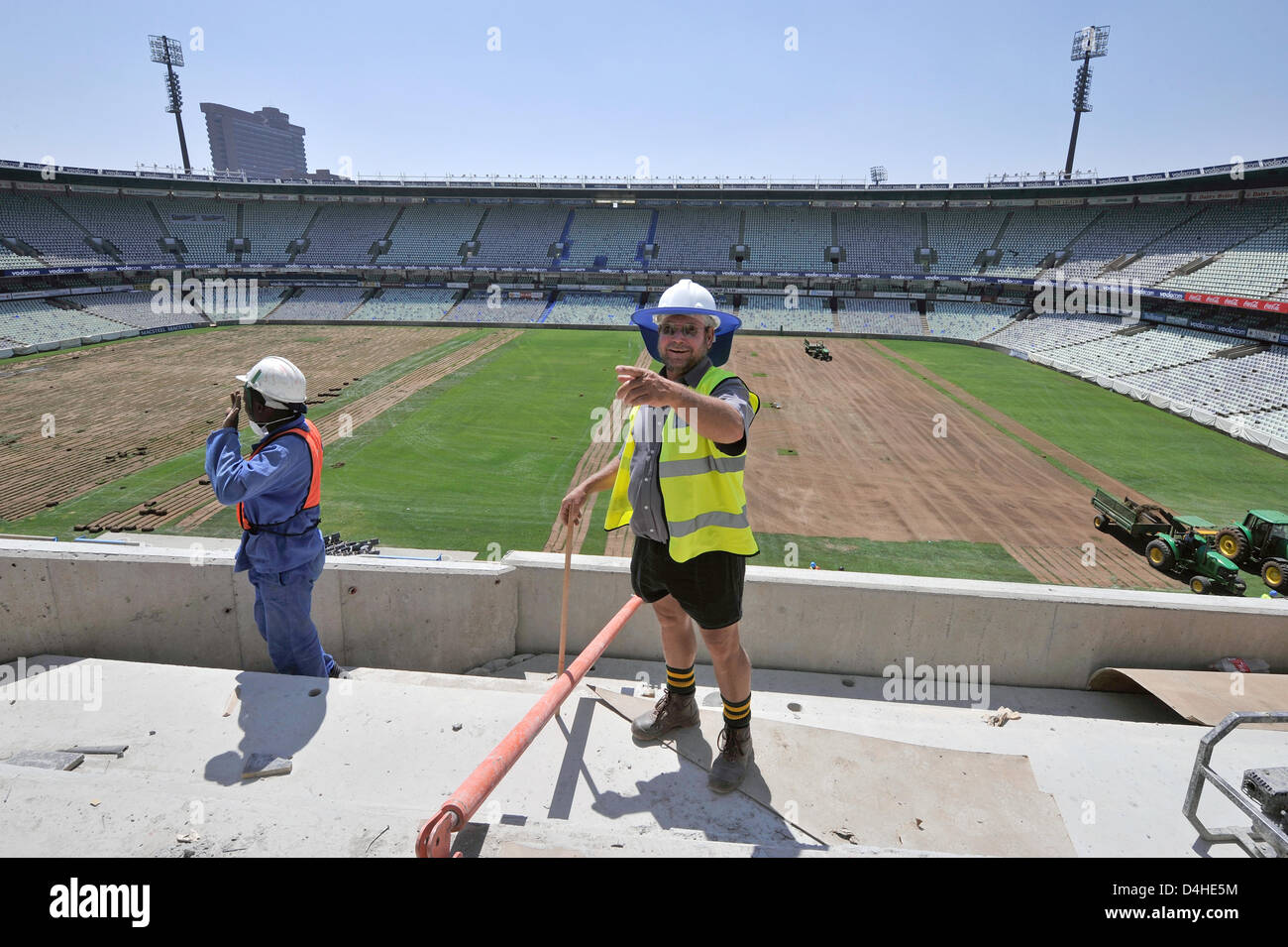 A construction worker gestures at the Free State Stadium in Bloemfontein, South Africa, 26 November 2008. Photo: Gero Breloer Stock Photo