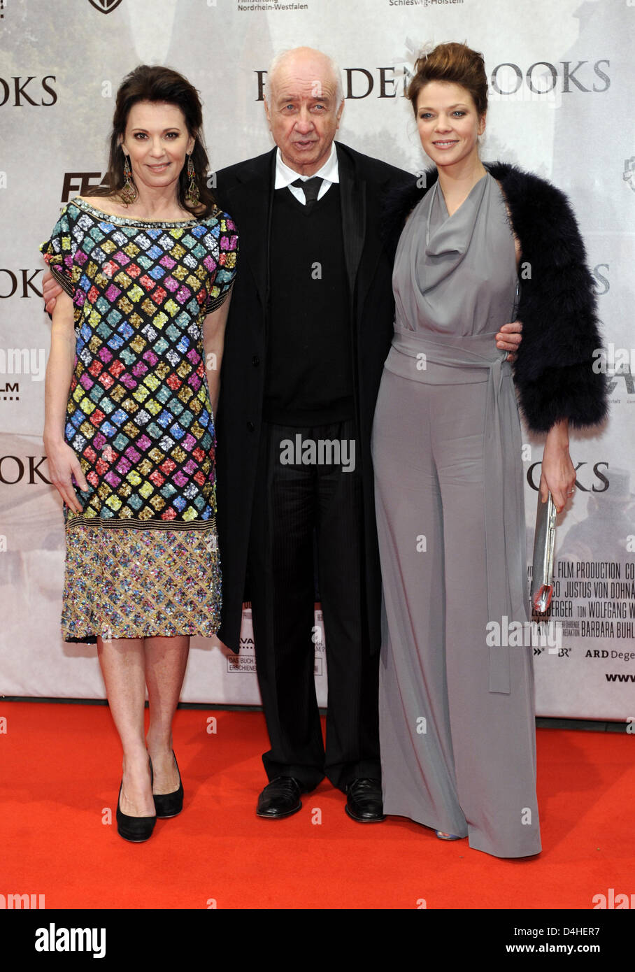 Actors and actresses Iris Berben (L-R), Arnim Mueller-Stahl and Jessica Schwarz arrive at the world premiere of the film ?Buddenbrooks? at ?Lichtburg? venue in Essen, Germany, 16 December 2008. The film based on the homonymous novel by Thomas Mann tells the story of the rise and fall of a rich German merchant family at the turn of the 19th and 20th century. ?Buddenbrooks? will be s Stock Photo