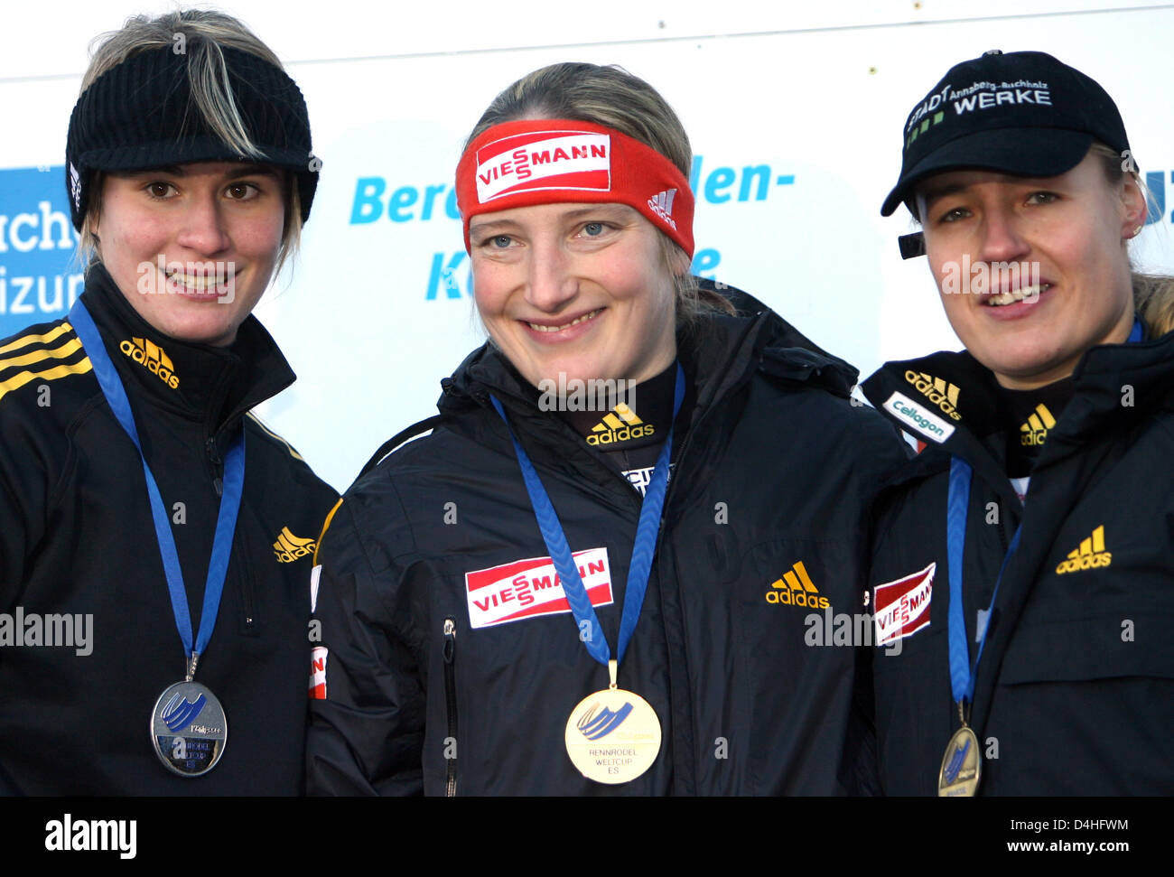 Germany?s (L-R) runner-up Natalie Geisenberg, winner Tatjana Huefner, and thrid-placed Anke Wischnewski cheer on the podium at the luge world cup event in Koenigssee, Germany, 03 January 2009. Photo: FRANK LEONHARDT Stock Photo