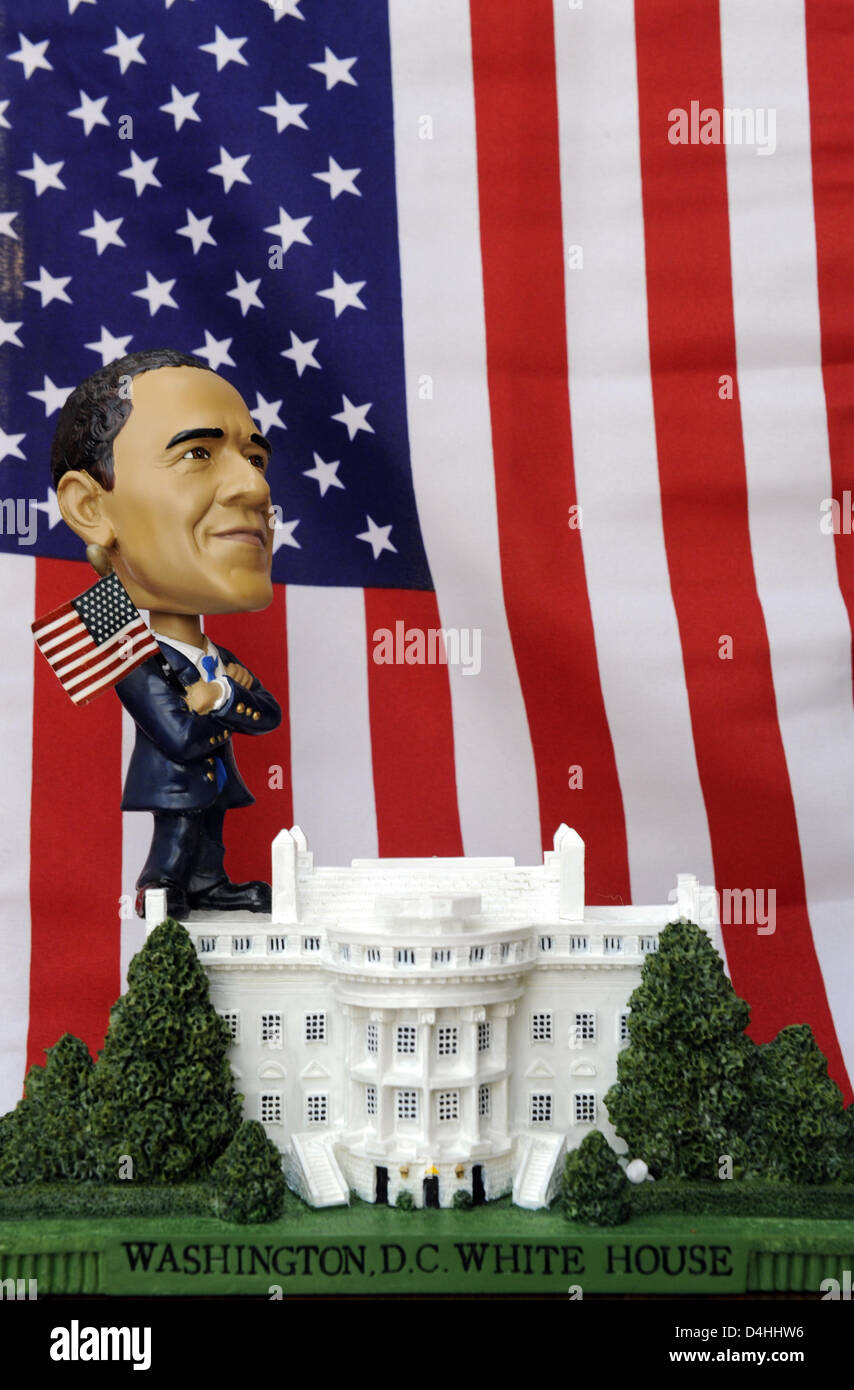 A figure of US President-elect Barack Obama stands on a model of the White House in front of a US flag in Berlin, Germany, 13 January 2009. Obama will be inaugurated as the 44th US President on 20 January in Washington D.C., USA. Obama will be the first African-American President and is a popular figure for merchandise. Photo: RAINER JENSEN Stock Photo