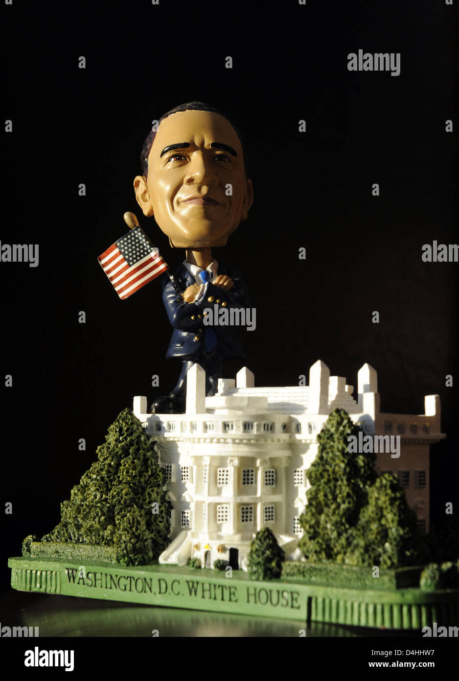 A figure of US President-elect Barack Obama with a US flag stands on a model of the White House in Berlin, Germany, 13 January 2009. Obama will be inaugurated as the 44th US President on 20 January in Washington D.C., USA. Obama will be the first African-American President and is a popular figure for merchandise. Photo: RAINER JENSEN Stock Photo