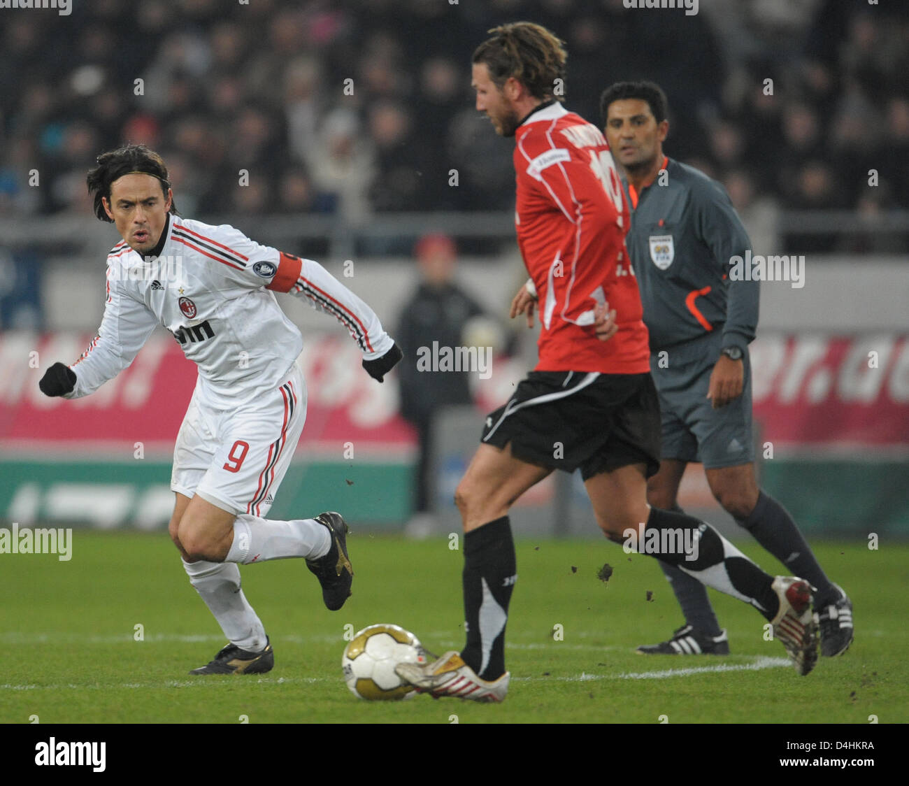 Hanover?s Christian Schulz (R) vies for the ball with Milan?s Filippo Inzaghi during the soccer friendly between German Bundesliga club Hanover 96 and Italian Serie A club AC Milan at AWD-Arena in Hanover, Germany, 21 January 2009. AC Milan defeated Hanover 3-2. Photo: Peter Steffen Stock Photo