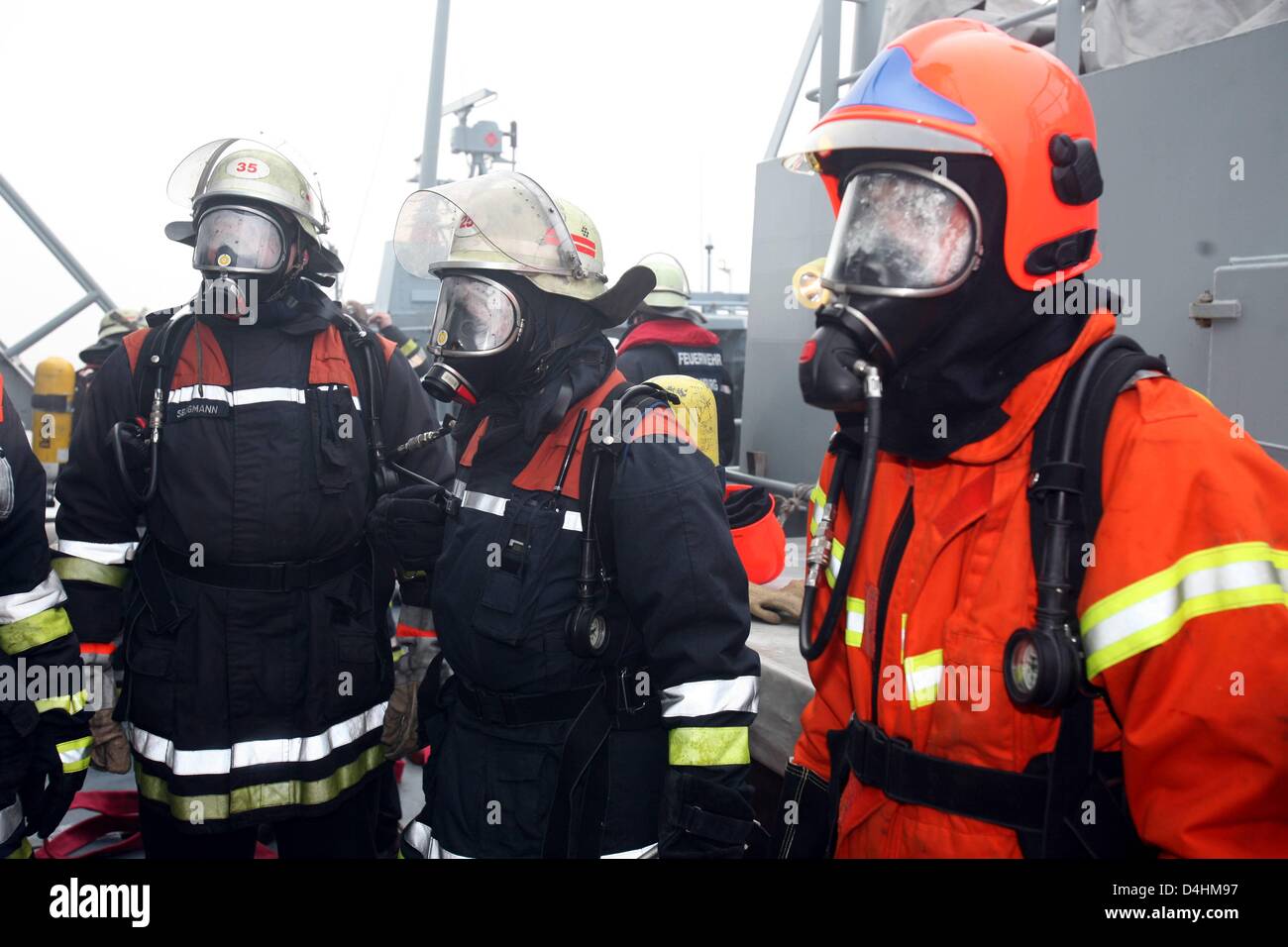 Danish navy soldiers and Hamburg-based firemen practice fire emergency ...