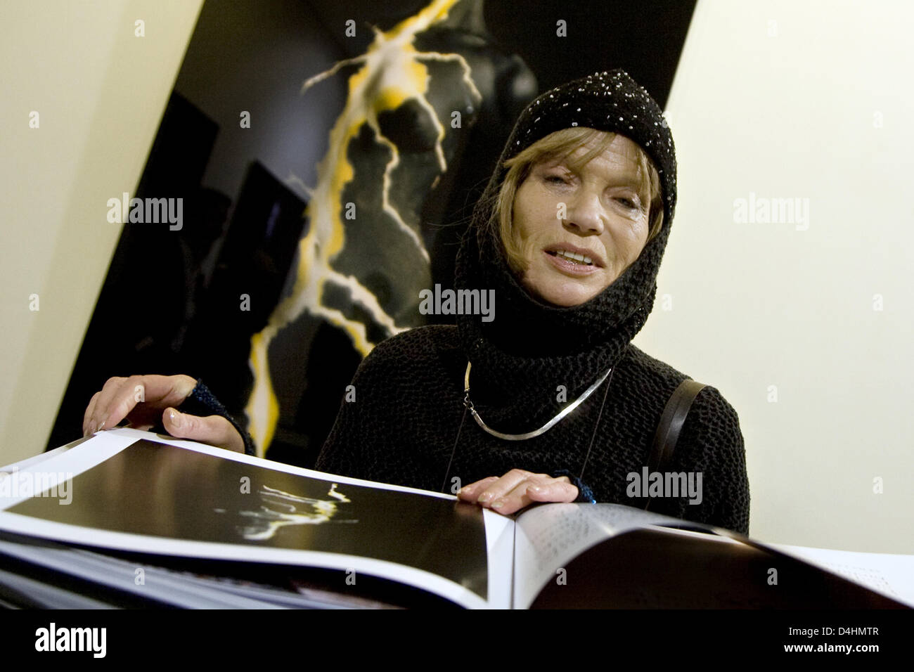 Actress, model, painter and photographer Veruschka von Lehndorff signs one of her books in front of the photography ?Yellow Flash? at the vernissage of the exhibition ?Veruschka? in the Gallery Lumas in Berlin, Germany, 29 January 2009. The exhibition can be visited until 03 March 2009. Photo: ARNO BURGI Stock Photo