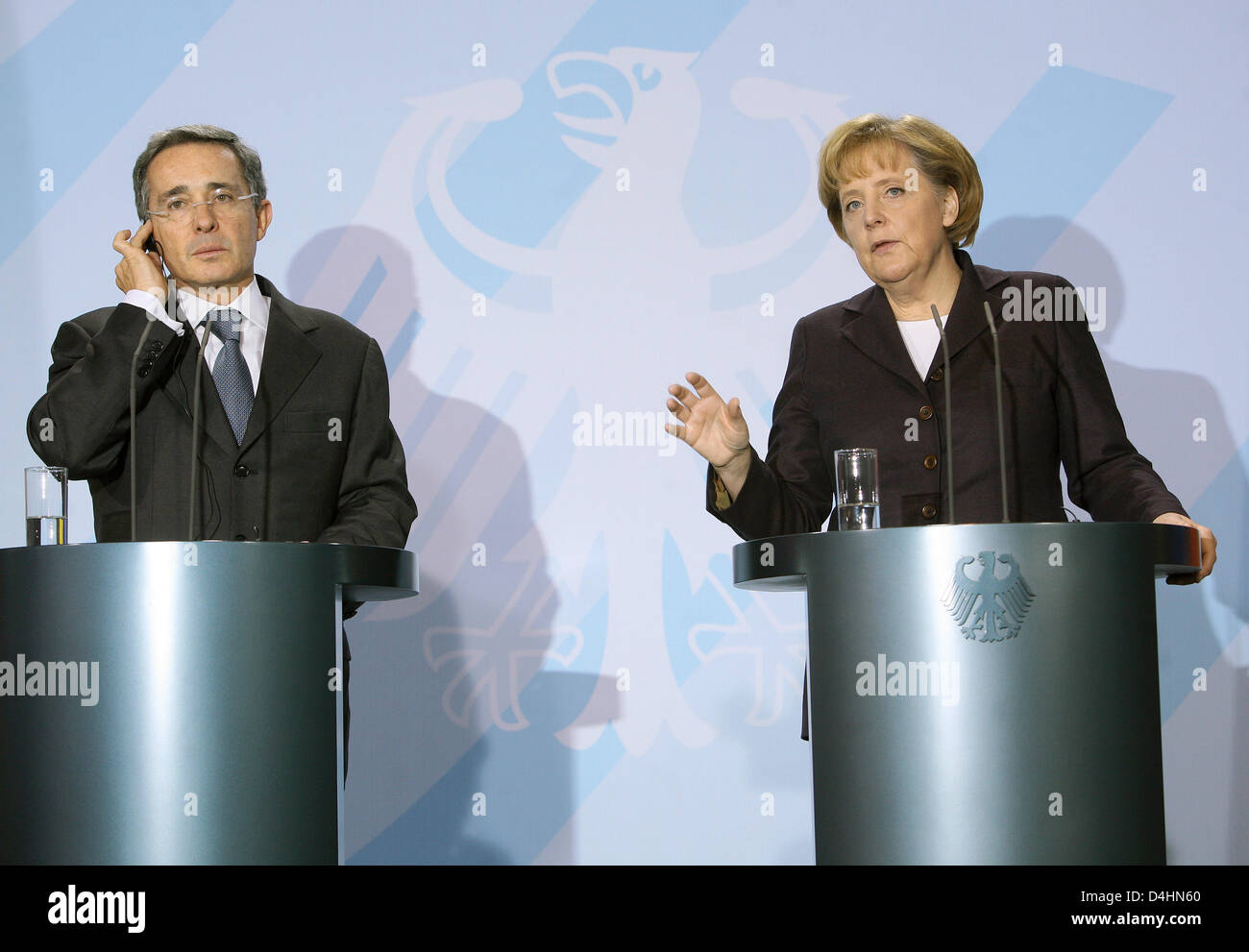German Chancellor Angela Merkel and Columbian President Alvaro Uribe Velez give a joint statement in the Chancellery in Berlin, Germany, 31 January 2009. Uribe was welcomed with military honours. Photo: Stephanie Pilick Stock Photo