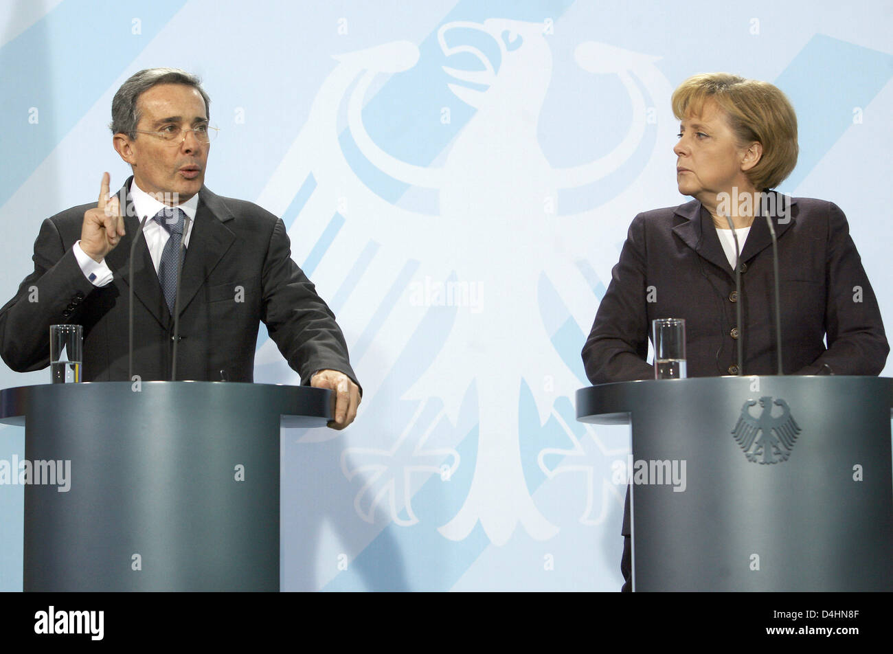 German Chancellor Angela Merkel and Columbian President Alvaro Uribe Velez give a joint statement in the Chancellery in Berlin, Germany, 31 January 2009. Uribe was welcomed with military honours. Photo: Stephanie Pilick Stock Photo