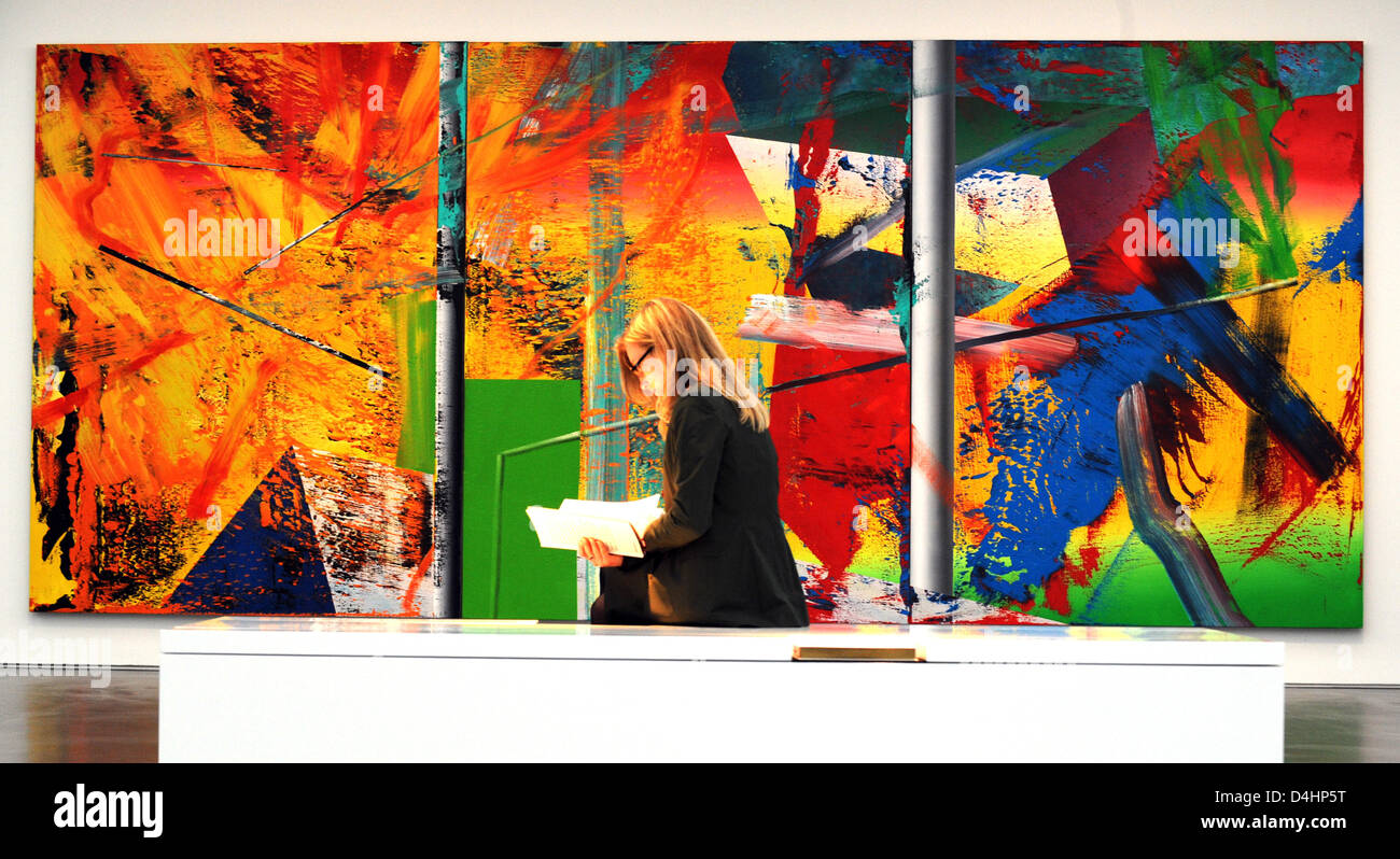A woman sits in front of the painting ?Atelier? by Gerhard Richter