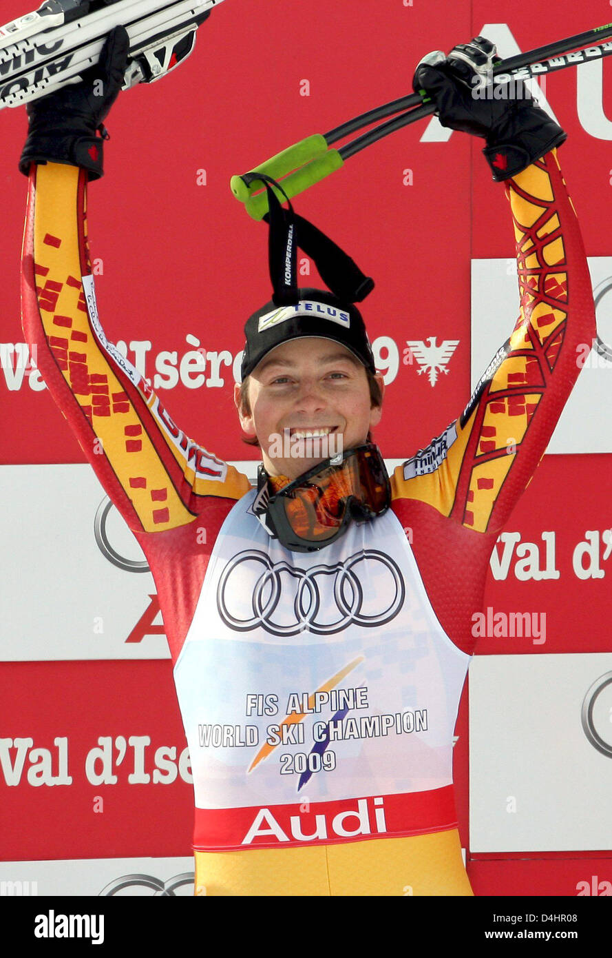 Canada?s gold medallist John Kucera celebrates on the podium after the Men?s Downhill