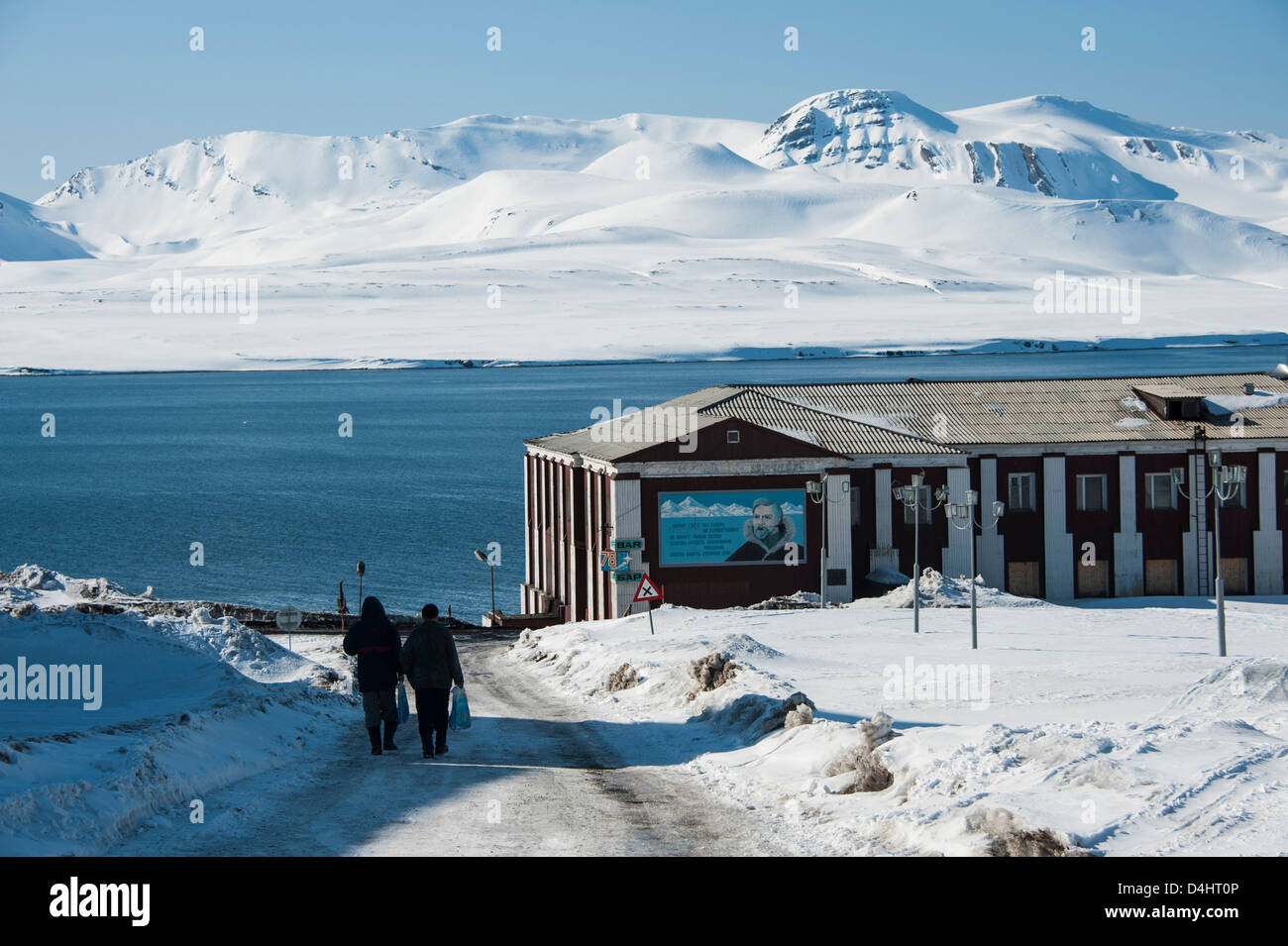 Frozen road in the Russian coal-mining town of Barentsburg on Spitsbergen in Norwegian Svalbard Stock Photo