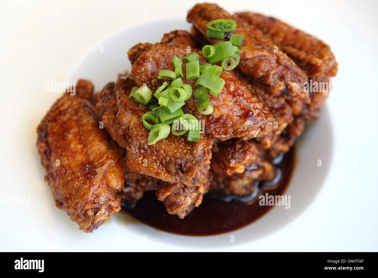 Barbecued chicken wings with sauce Stock Photo