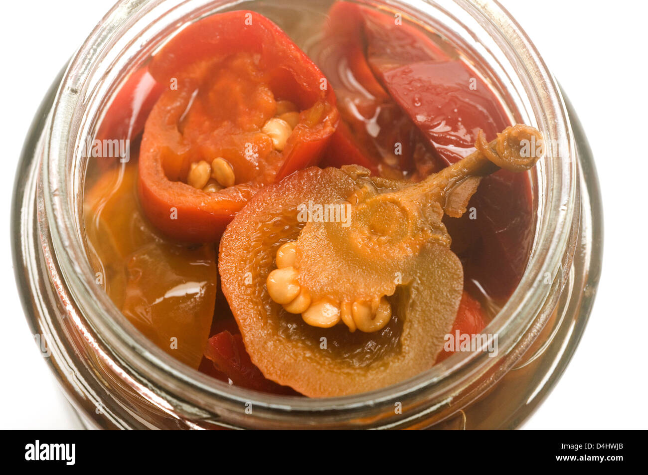 hot cherry peppers red and green appetizer in glass jar Stock Photo