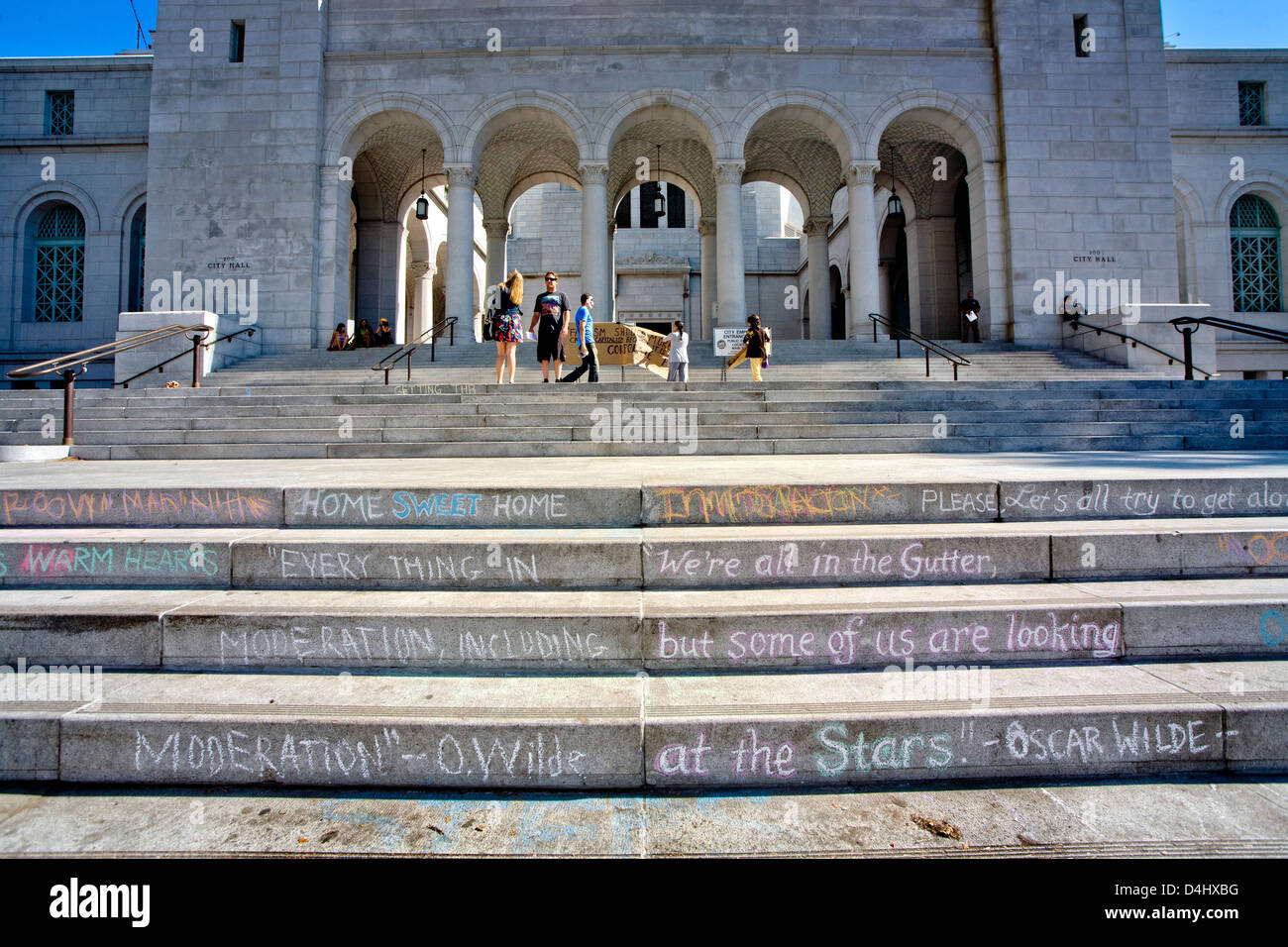 Chalked Occupy Wall Street statements and opinions decorate the steps of Los Angeles City Hall Stock Photo