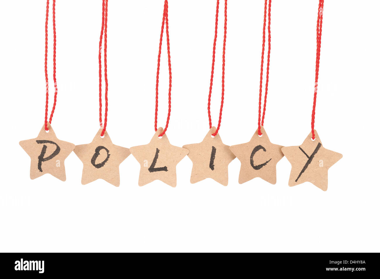 Policy word spelled with paper stars are hung by ropes, isolated against white background Stock Photo