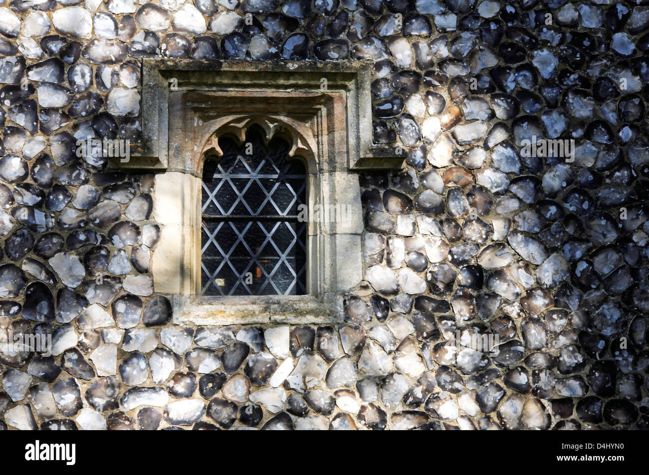 An example of flint work on the vestry wall at the church of St Andrew at Trowse Newton, Norwich, Norfolk, England, UK. Stock Photo
