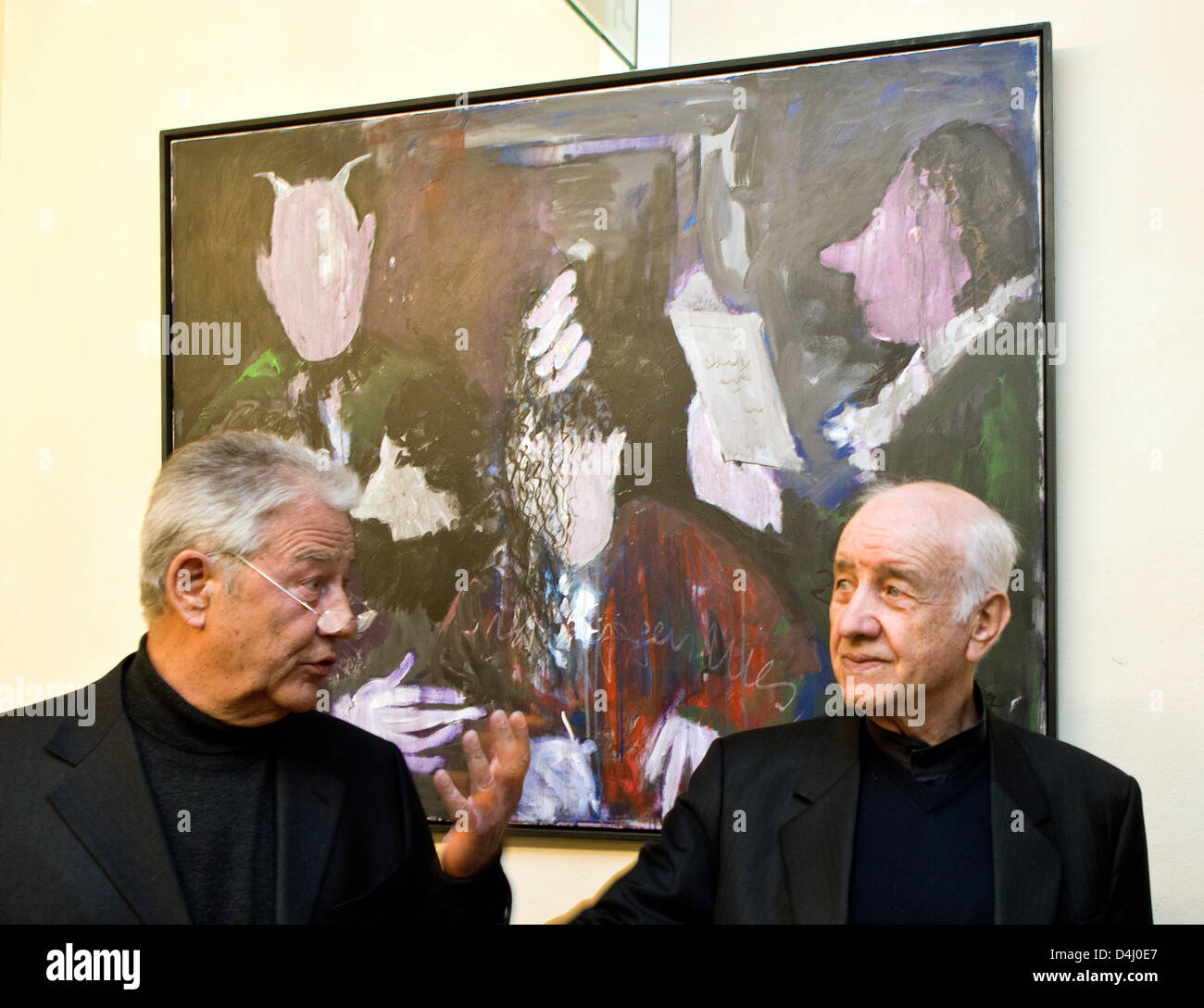Actor Armin Mueller-Stahl (R) and his friend former Governor of Schleswig-Holstein Bjoern Engholm stand in front of one of Mueller-Stahl's paintings in the Culture Church in Neuruppin, Germany, 14 March 2013. This evening, the exhibition of pictures by Armin Mueller-Stahl opens with around 60 works and is open until 31 May. One of the themes is 'Faust. The autodidact has also drawn a portrait of Theodor Fontane, who was born in Neuruppin. Photo: PATRICK PLEUL Stock Photo
