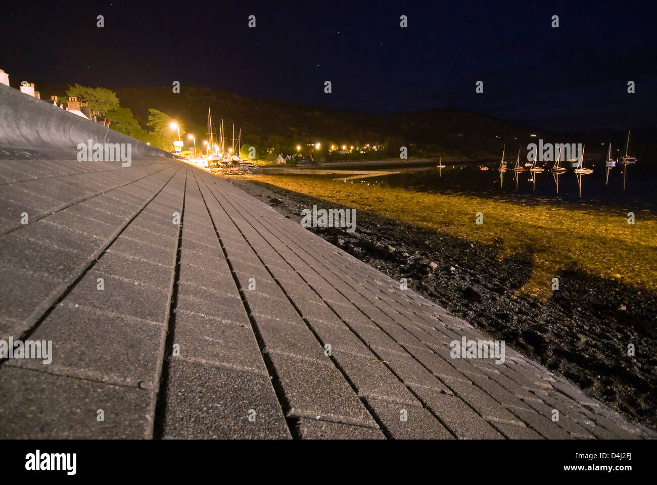 Sea wall at night, Ullapool, Highlands, Scotland Stock Photo