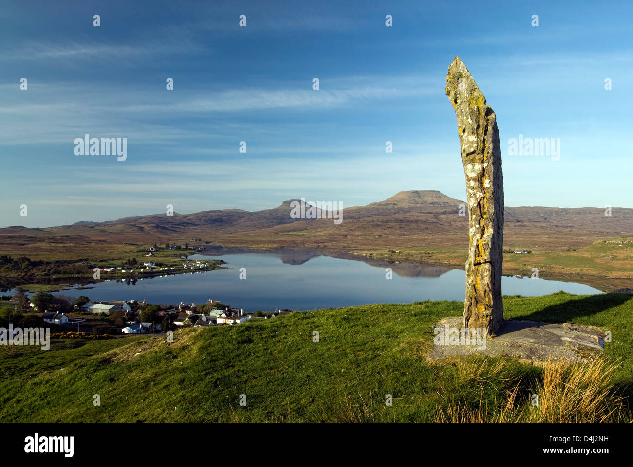 Dunvegan standing stone on hilltop above Dunvegan, Isle of Skye, Scotland. Macleod's Tables in the background. Stock Photo