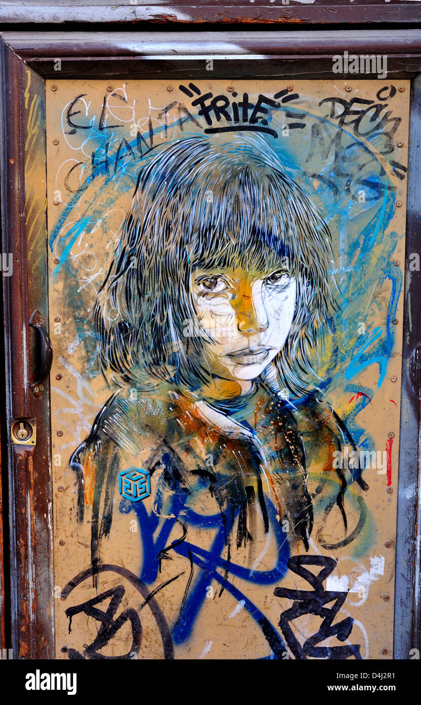Barcelona, Catalonia, Spain. Graffiti on a door. Girl's face Stock Photo