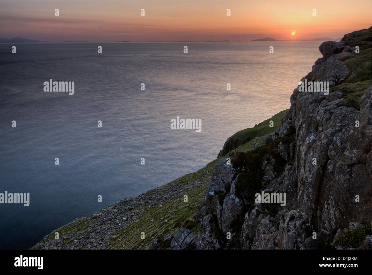 Sunset over the Outer Hebrides from Neist Point, Isle of Skye, Scotland Stock Photo