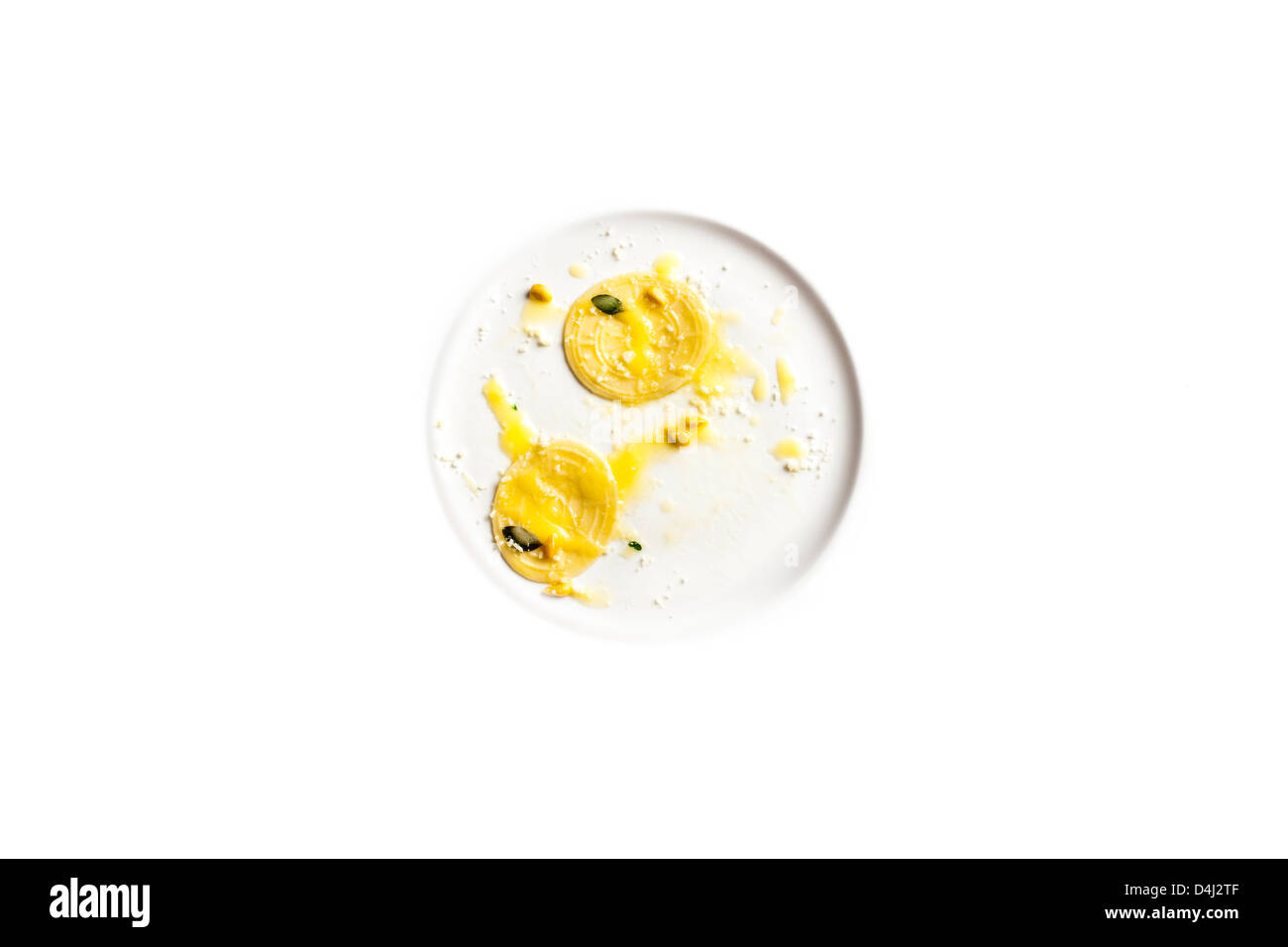 Corzetti - Stamped homemade pasta from the Liguria region of Italy served with butter, Marjoram and toasted pinenuts. Stock Photo