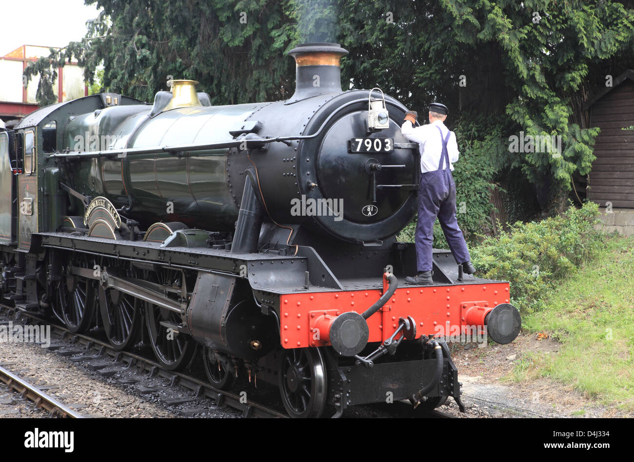 Driver preparing the Gloucestershire Warwickshire steam railway in the