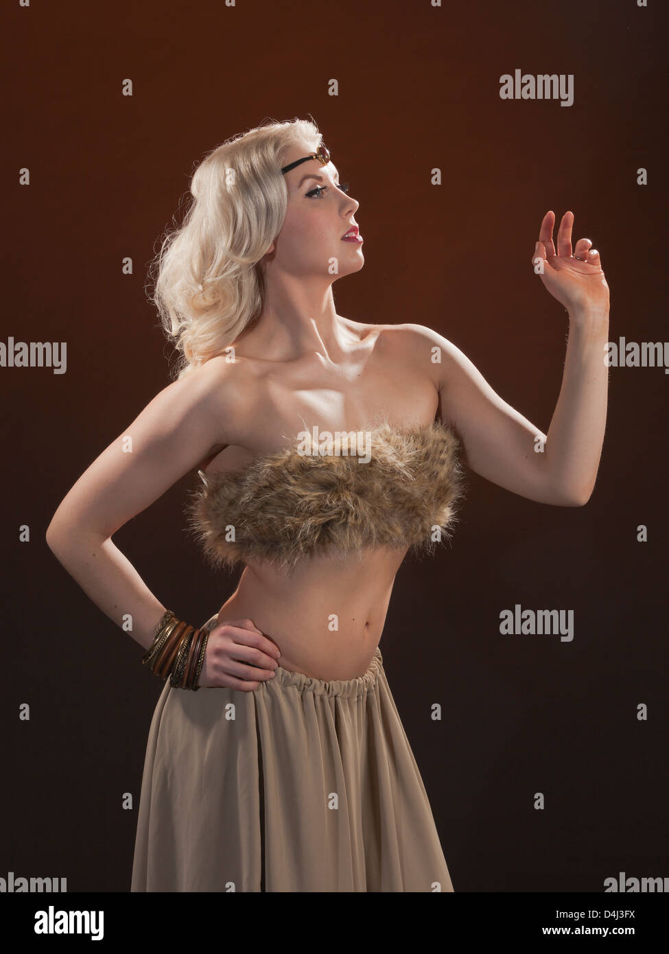 An young beauty blond well groomed woman with fur tippet. Stock Photo