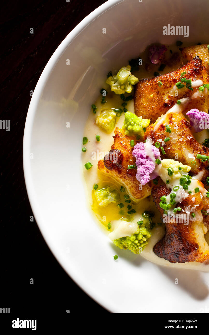 Loaded Gnocchi with Cauliflower and Chives prepared by Rob Ruban, Executive Chef of Crossbar in New York, NY. Stock Photo