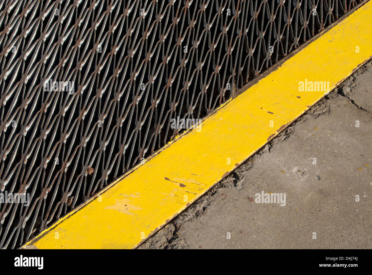 metal grate and yellow stripe Stock Photo Alamy