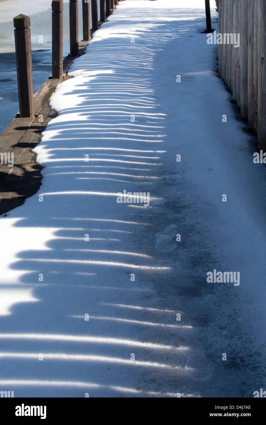 Snowy path by Erie Canal. Stock Photo