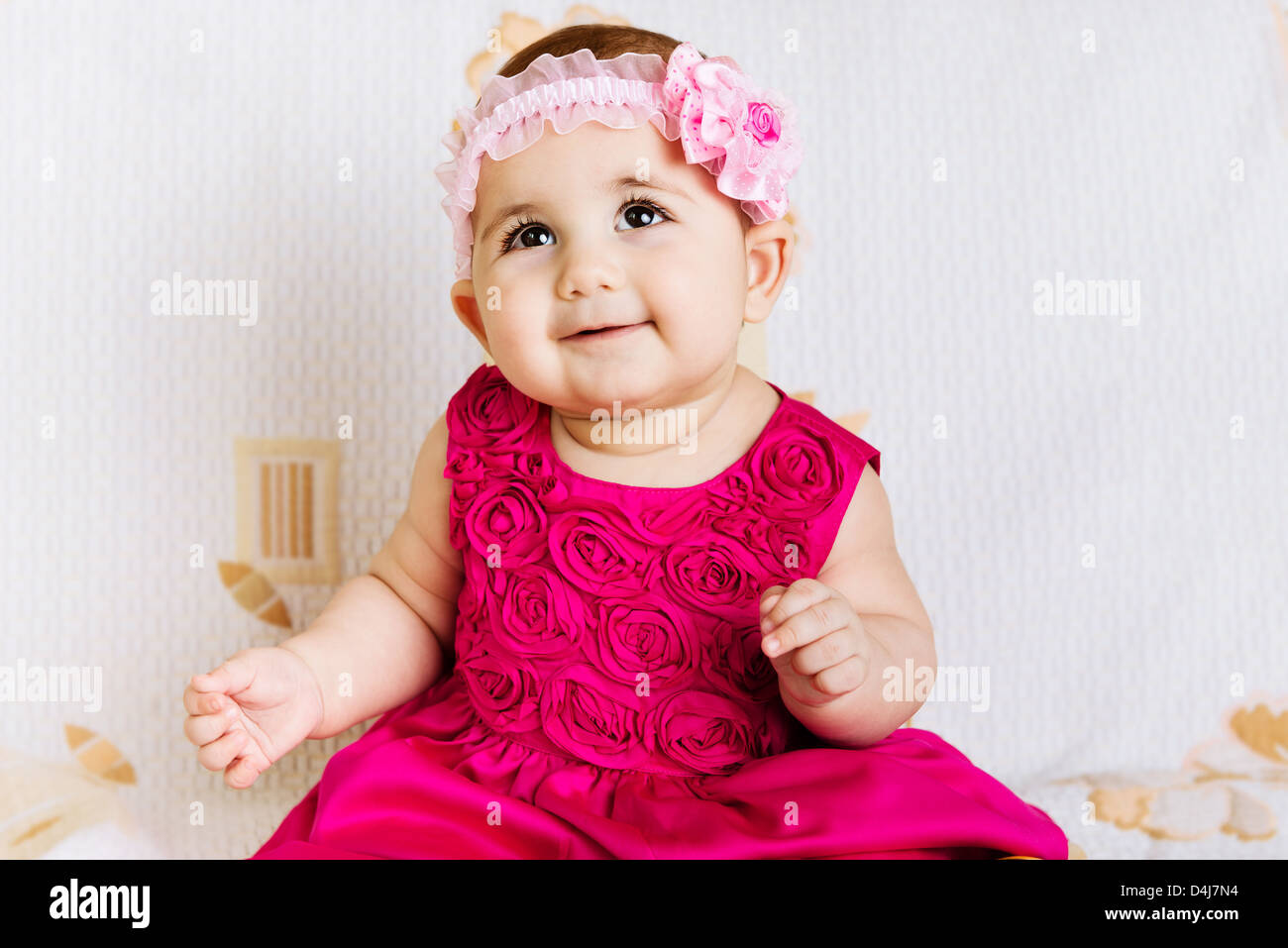 Cute baby girl in pink floral dress Stock Photo - Alamy
