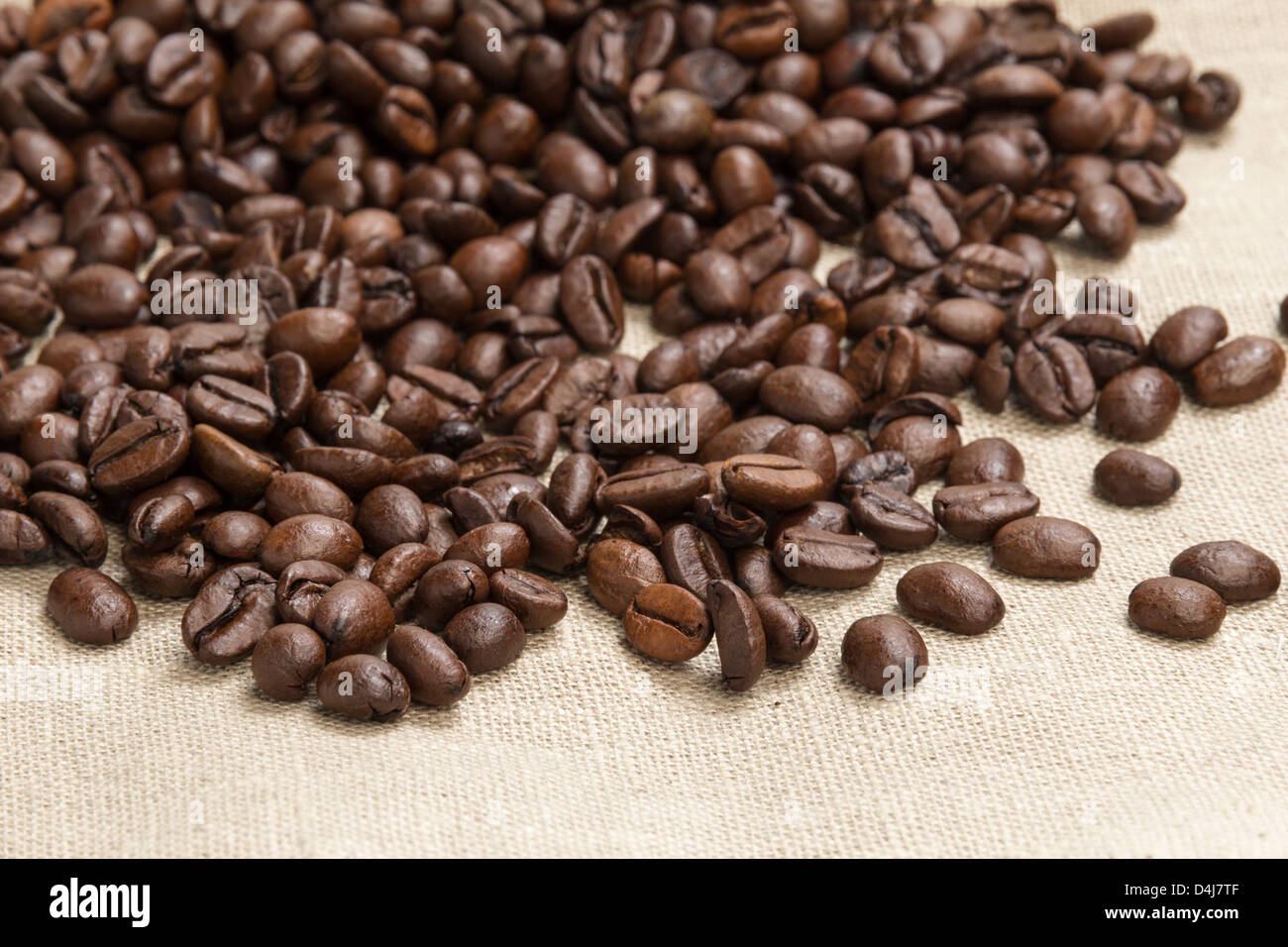 heap of coffee beans on burlap, background Stock Photo - Alamy