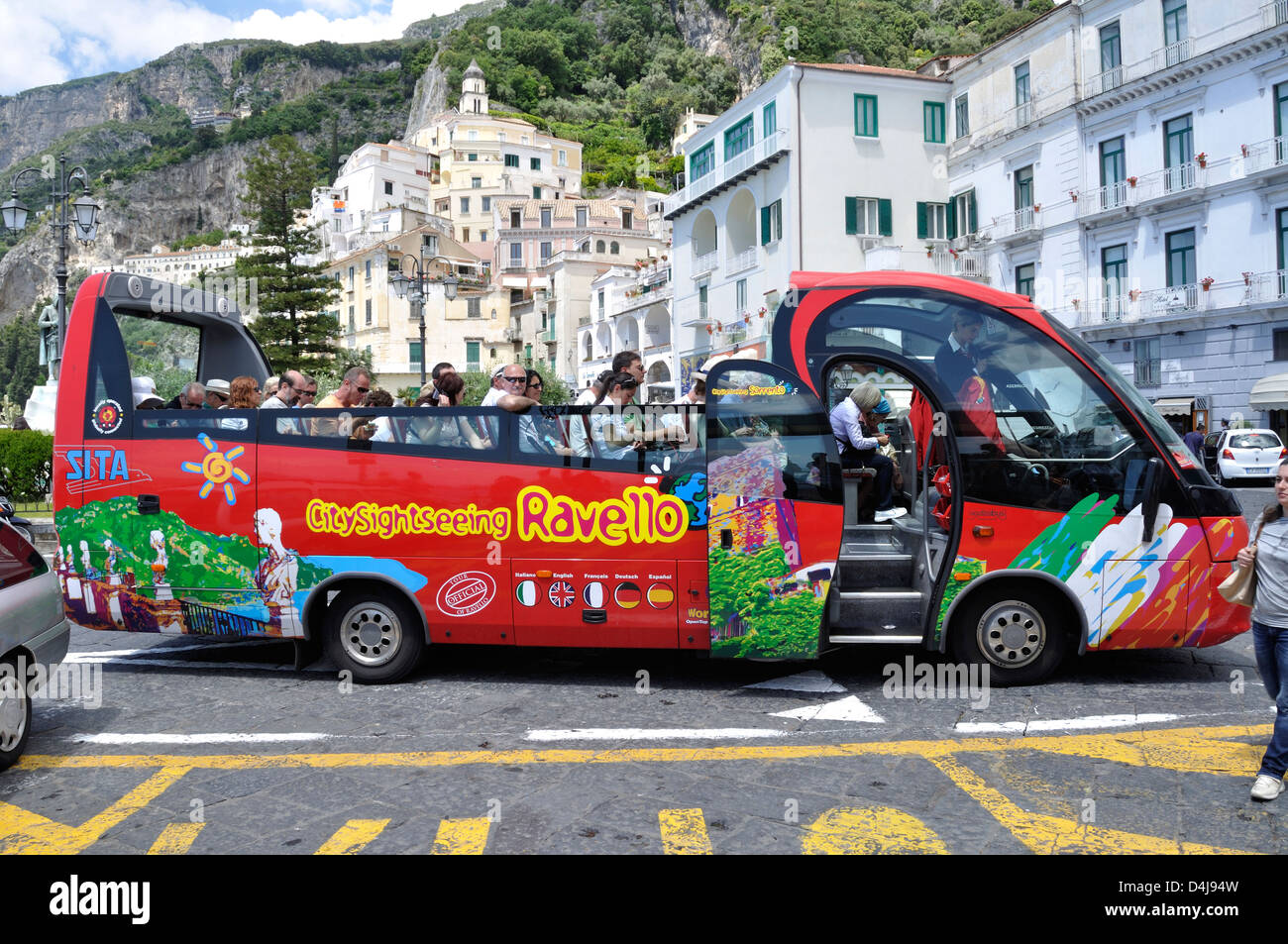 An open top sightseeing bus gets ready to depart from Piazza Flavio Gioia  in Amalfi, Italy Stock Photo - Alamy