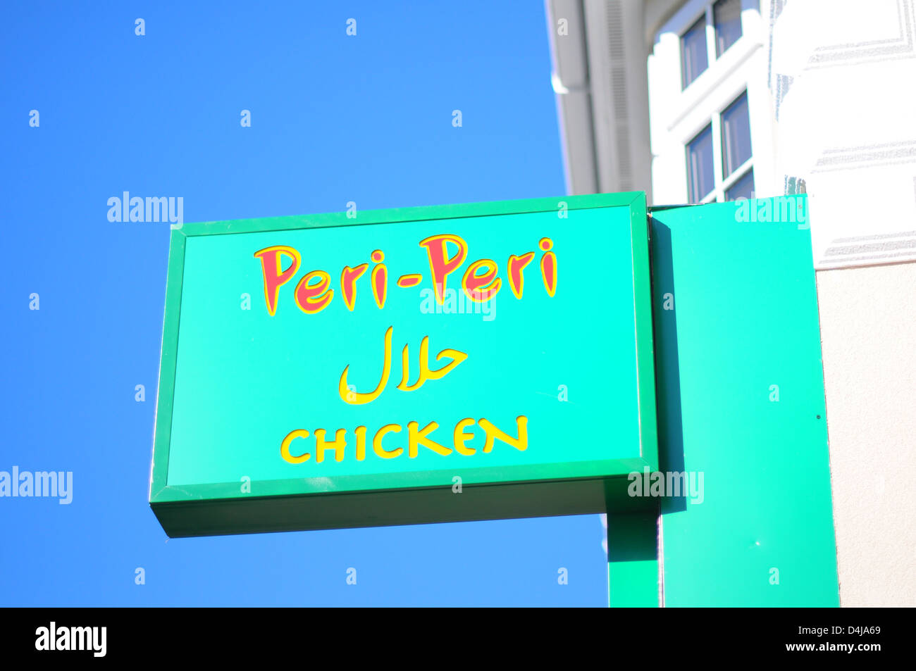 Sign outside an independent fast food outlet 'Peri Peri Chicken' in Bury Park, Luton, England. Stock Photo