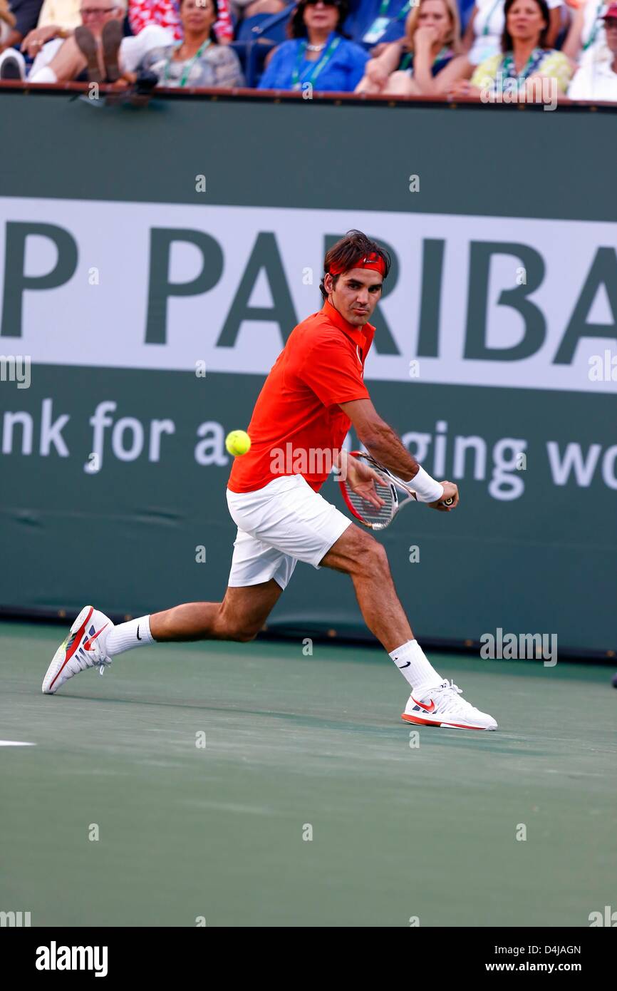 Indian Wells, USA. 13th March 2013. Roger Federer of Switzerland returns a  shot to Stanilas Wawrinka of Switzerland during the BNP Paribas Open at Indian  Wells Tennis Garden in Indian Wells CA.