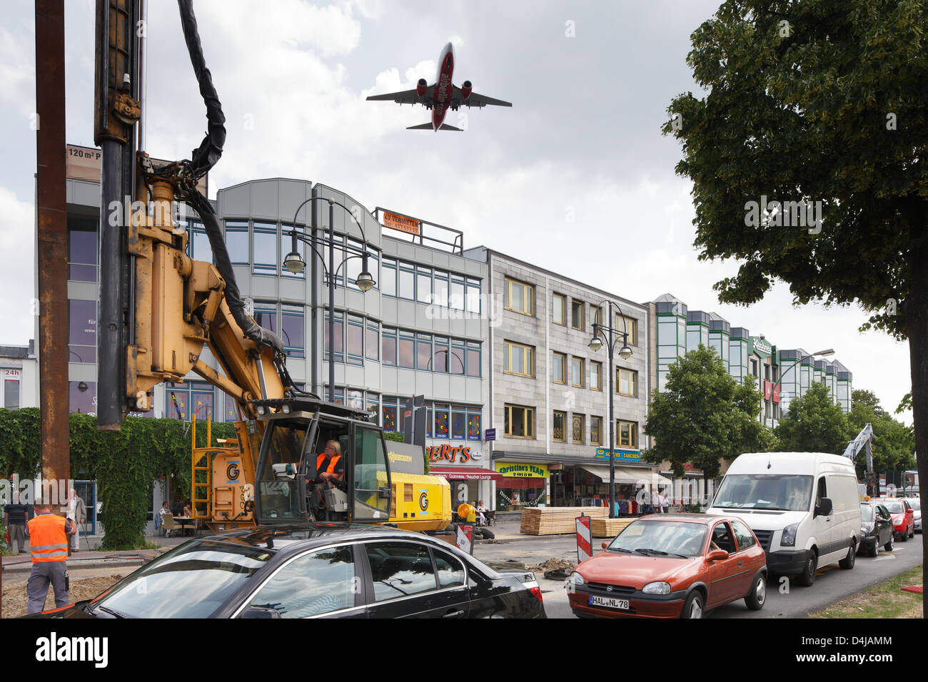 Berlin, Germany, the plane flies over the Kurt-Schumacher-Platz Stock