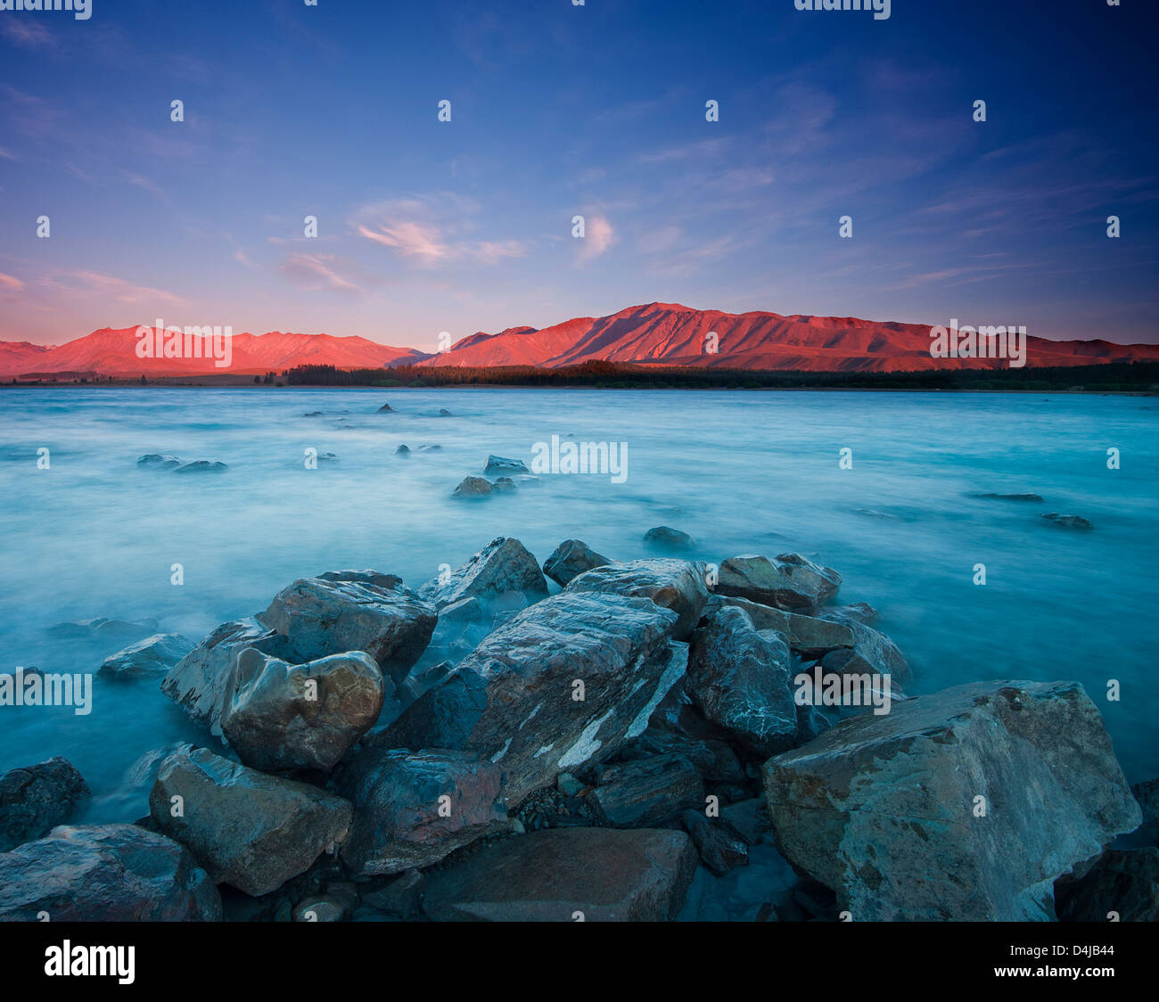 View of Lake Tekapo during late evening Stock Photo - Alamy
