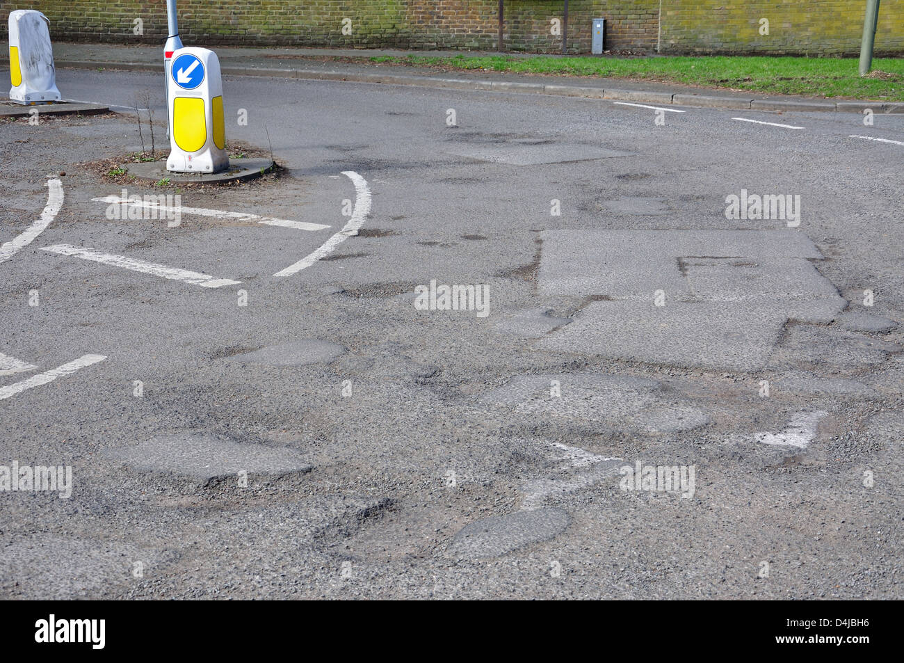 Potholes on Hithermoor Road, Stanwell Moor, Borough of Spelthorne, Surrey, England, United Kingdom Stock Photo
