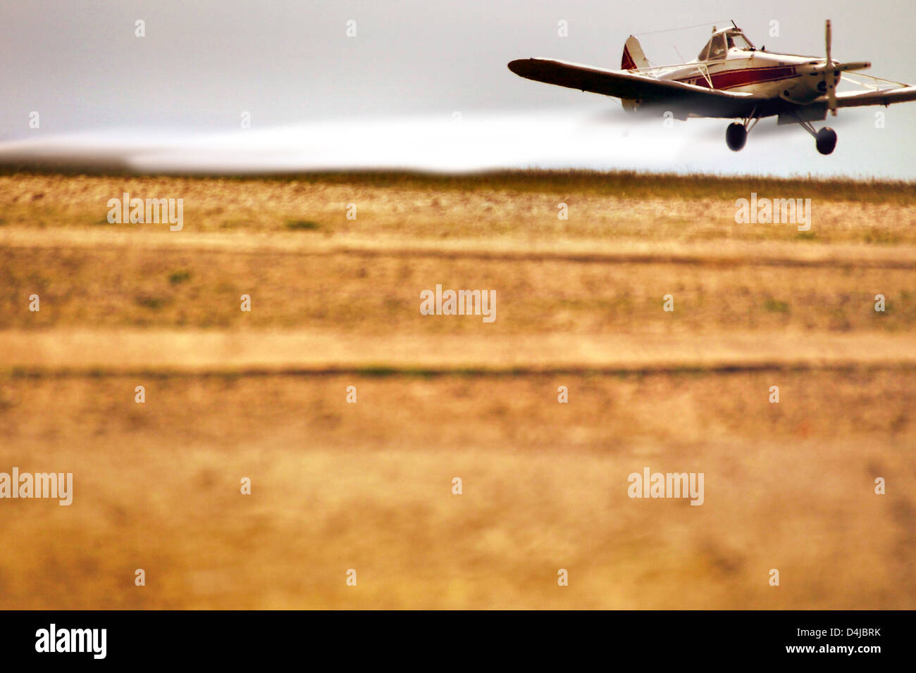 Crop duster praying field Stock Photo