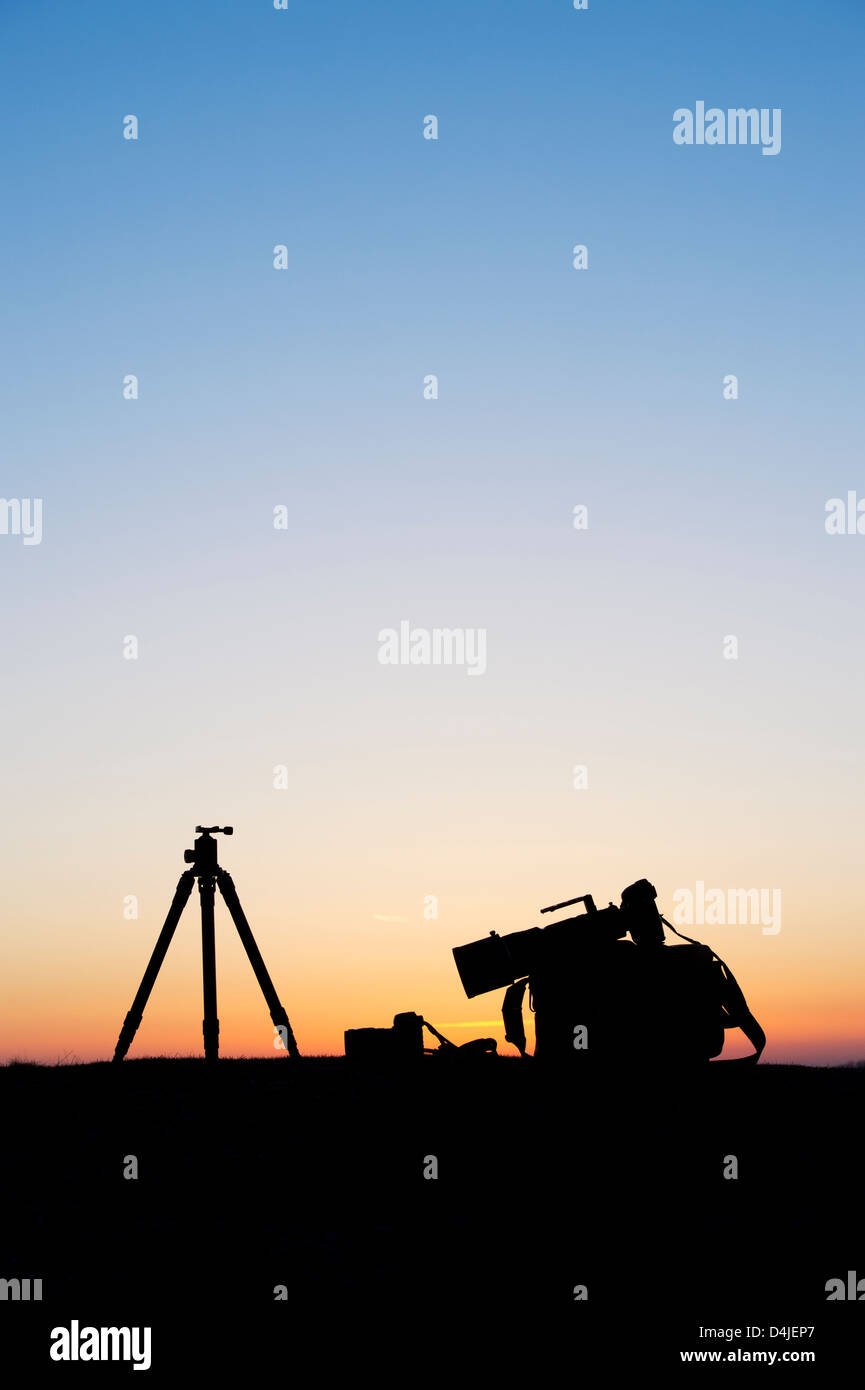 Camera equipment at sunrise. Silhouette Stock Photo