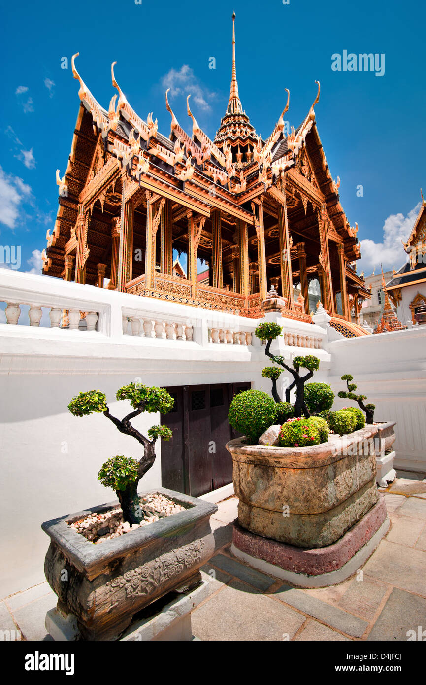 Grand Royal Palace with bonsai tree garden. Wat Phrasrirattana Sasadaram and Wat Phra Kaew, Bangkok City, Thailand Stock Photo