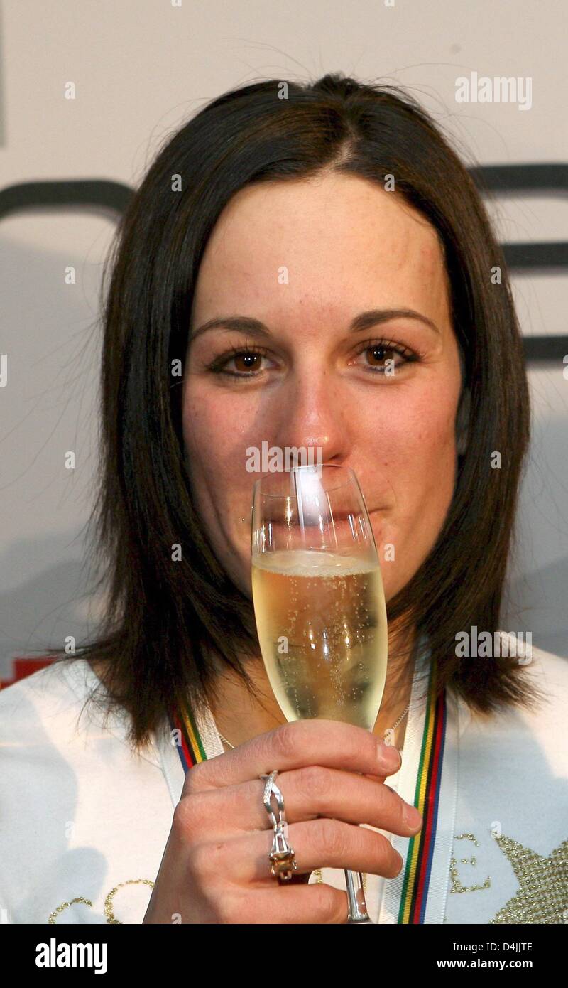 Germany?s Kathrin Hoelzl poses with a glass of champagne at a German party for the Women?s Giant Slalom during the Alpine World Ski Championships in Val d?Isere, France, 12 February 2009. Photo: Stephan Jansen Stock Photo