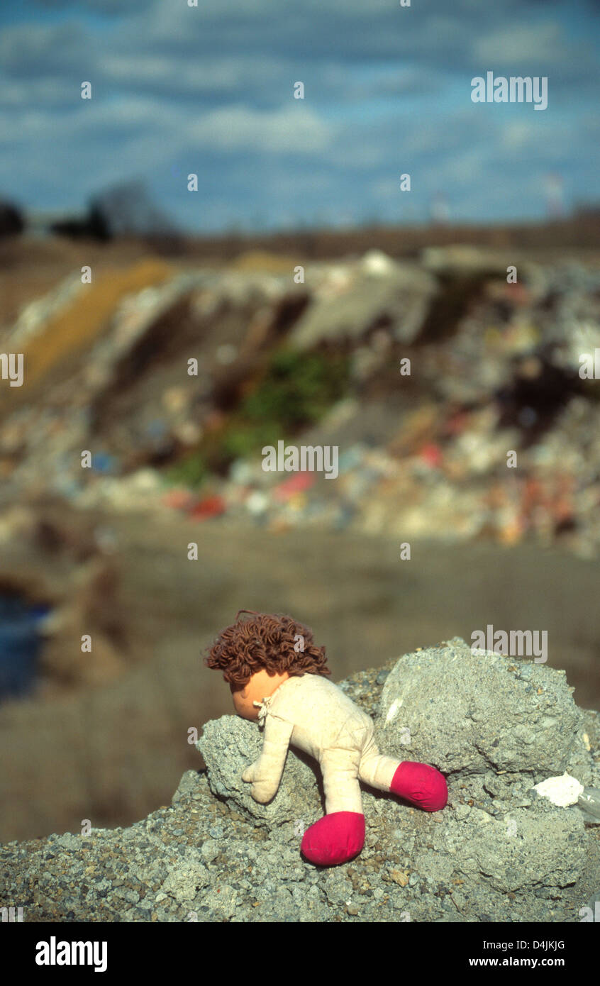 Doll on a rubbish dump Stock Photo