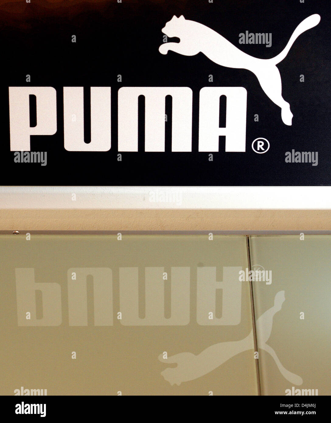 The Puma logo is pictured prior to the balance press conference of the German shoes and sportswear company in Nuremberg, Germany, 18 February 2009. Puma-CEO Zeitz had raised the full year sales forecast in the autumn of 2008 and predicted a median or high one-digit percent growth. In 2007 Puma generated proceeds of 2.4 billion euro. Photo: DANIEL KARMANN Stock Photo