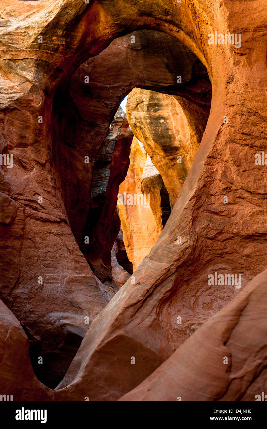 Arch inside Peek-A-Boo Slot Canyon at Hole in a Rock Road in Grand Staircase National Monument, Utah, USA Stock Photo