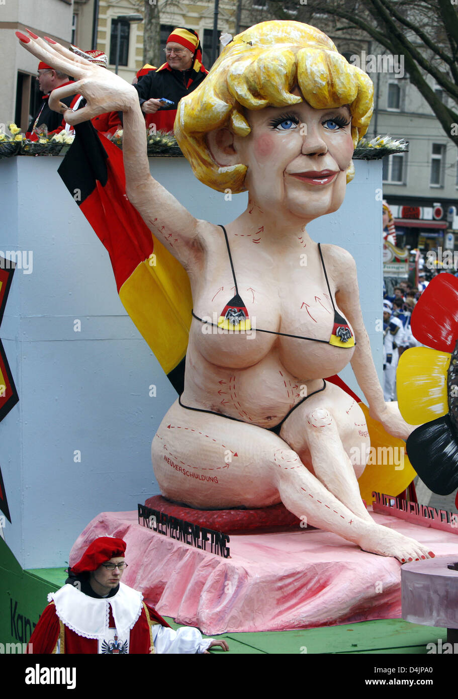 A float with an optically ?upgraded? version of German Chancellor Merkel seen during the Shrove Monday parade in Cologne, Germany, 23 February 2009. On Shrove Monday tens of thousands carnival goers celebrate in the streets of Duesseldorf, Cologne and other carnival strongholds. Photo: Oliver Berg Stock Photo