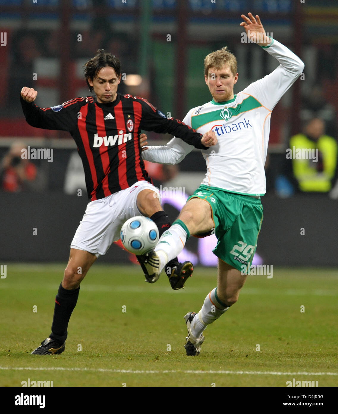 Bremen?s Per Mertesacker (R) and Milan?s Filippo Inzaghi seen in action during the UEFA Cup match AC Milan vs Werder Bremen at Guiseppe Meazza stadium in Milan, Italy, 26 February 2009. The match tied 2-2, Bremen is now in the second round. Photo: Carmen Jaspersen Stock Photo