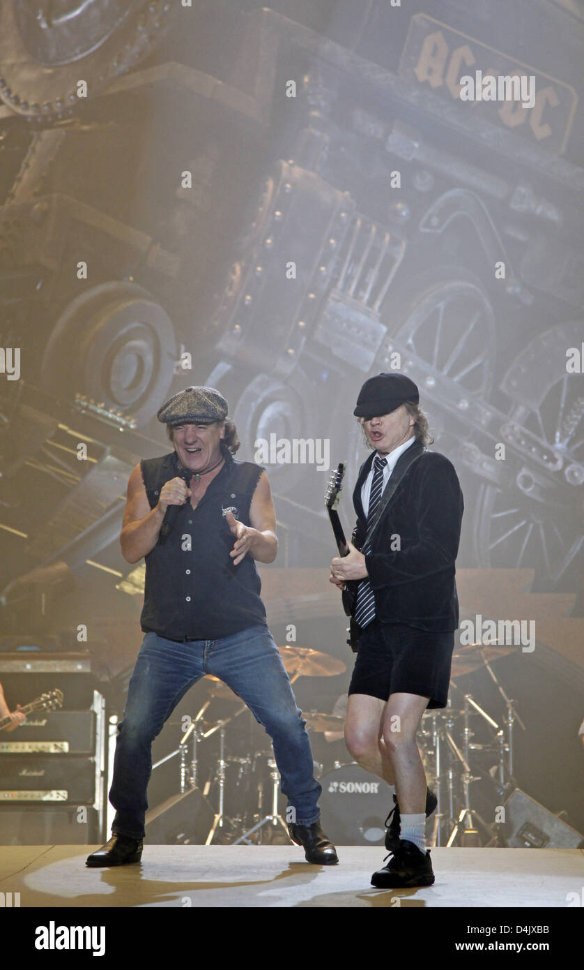 Singer Brian Johnson (L) and guitarist Angus Young of the Australian band ?AC/DC? perform during their first German concert in Leipzig, Germany, 05 March 2009. All concerts of the band?s German tour were sold out within minutes. Their first album in eight years ?Black Ice?, which was released in October 2008, stormed the top of the charts. The musicians, who can look back on 35 yea Stock Photo