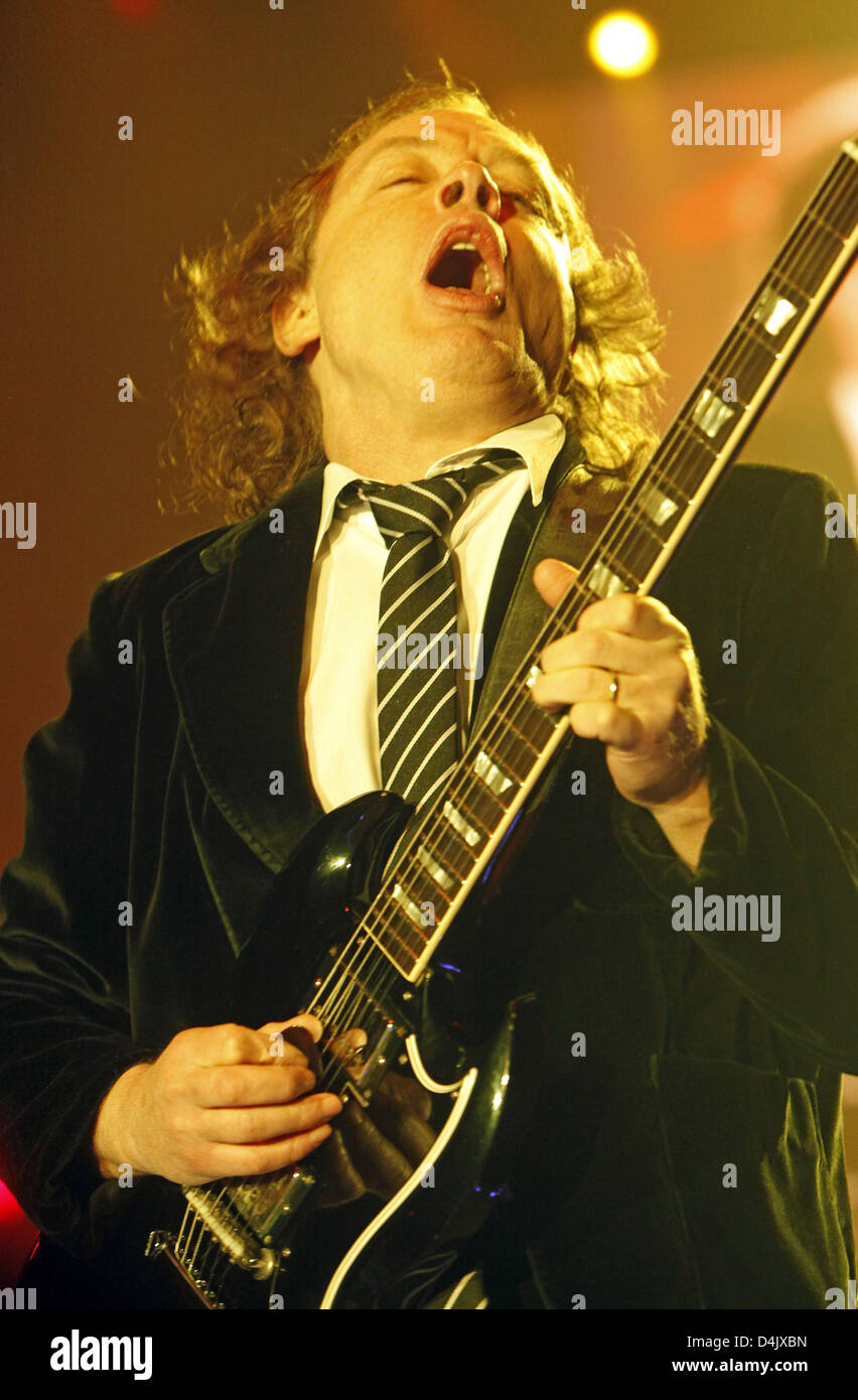 Guitarist Angus Young of the Australian band ?AC/DC? performs during the band?s first German concert in Leipzig, Germany, 05 March 2009. All concerts of the band?s German tour were sold out within minutes. Their first album in eight years ?Black Ice?, which was released in October 2008, stormed the top of the charts. The musicians, who can look back on 35 years of their band?s hist Stock Photo