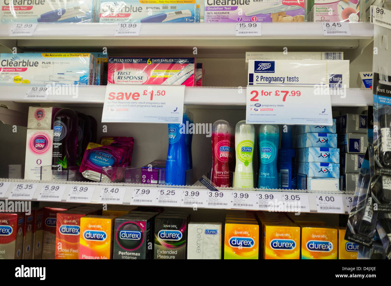 Pregnancy testing kits and condoms on sale in Boots the Chemist pharmacy UK  Stock Photo - Alamy