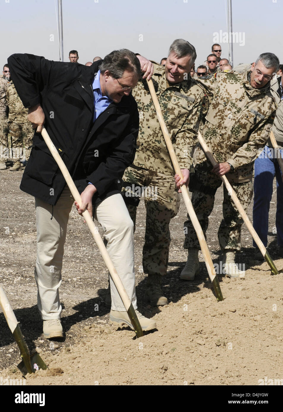 (L-R) German Defence Minister Franz Josef Jung, the assistant chief of staff at the ISAF headquarters, General Hans-Erich Antoni, and ISAF Commander North, General Joerg Vollmer perform the ground breaking ceremony for the new runway at the airport in Masar-i-Scharif, Afghanistan, 10 March 2009. The new runway for the designated air traffic hub will be 3,000m long and 45m wide. Mr  Stock Photo
